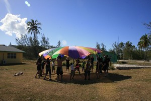 Students with Parachute on Exuma Mission Trip